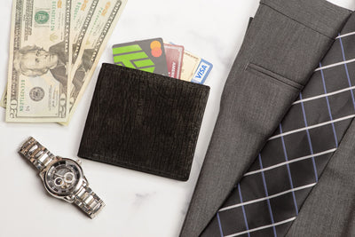 Pants, money, watch and black alligator bifold leather wallet with cards by Bullhide Belts